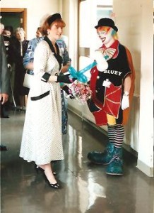 Clown Bluey presents HRH Princess of York with a balloon flower