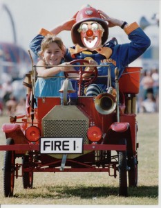 Oh no – a woman driver!! Chief Fire Officer Clown Bluey gets driven ‘off-road’ by an enthusiastic young lady volunteer.