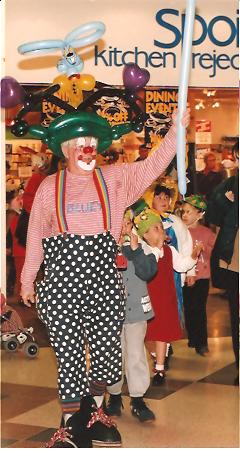Clown Bluey leads the Easter Bonnet Parade, Marlands Shop Mall