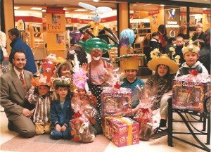 Clown Bluey and the winners of the Easter Bonnet competition